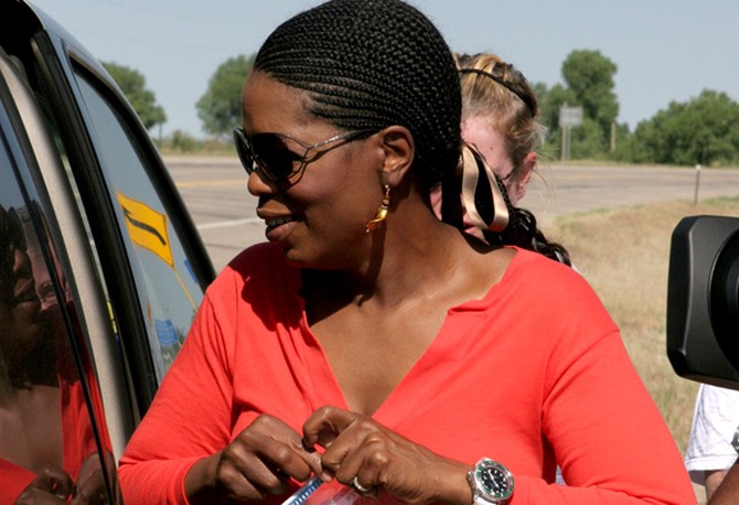 Oprah holding some car snacks