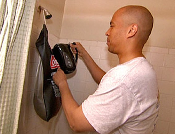 Mayor Booker fills his shower with warm water.