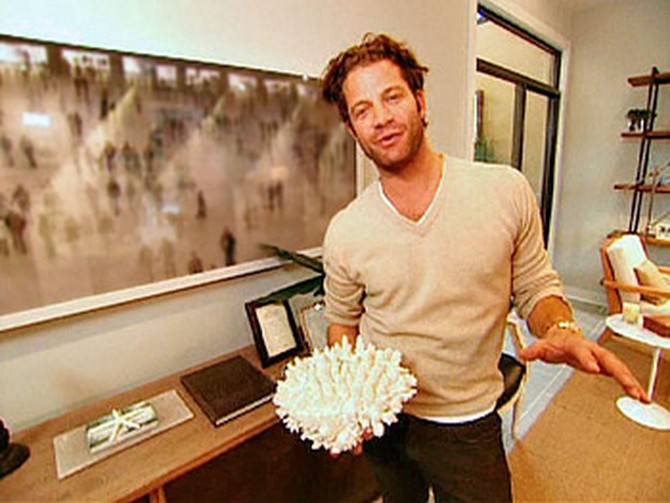 Nate Berkus holds a piece of coral.