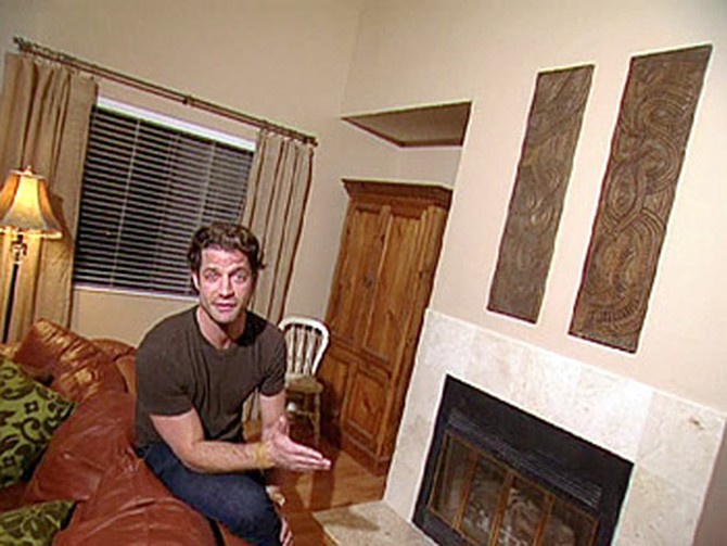 Nate shows off the new fireplace look.