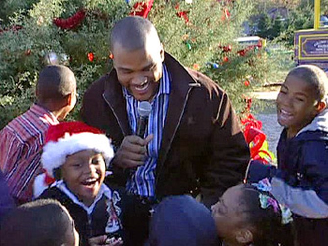 Tyler Perry delivers Christmas gifts to Oprah Katrina Homes families.
