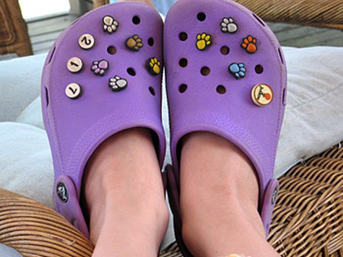 Jibbitz on a pair of purple Crocs