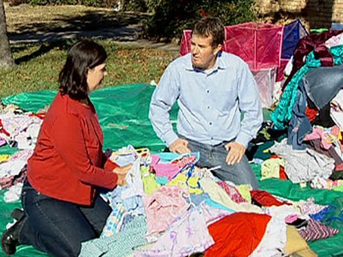Peter and Janet sort through clothes.