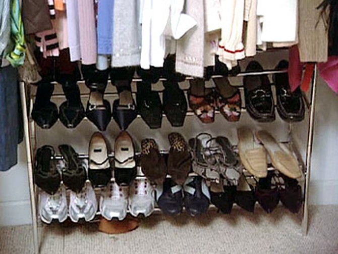 A shoe rack provides more organization in Ella's closet.
