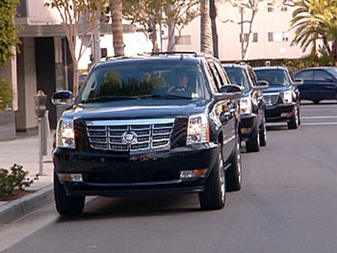 The guests arrive in stylish Cadillac Escalades.