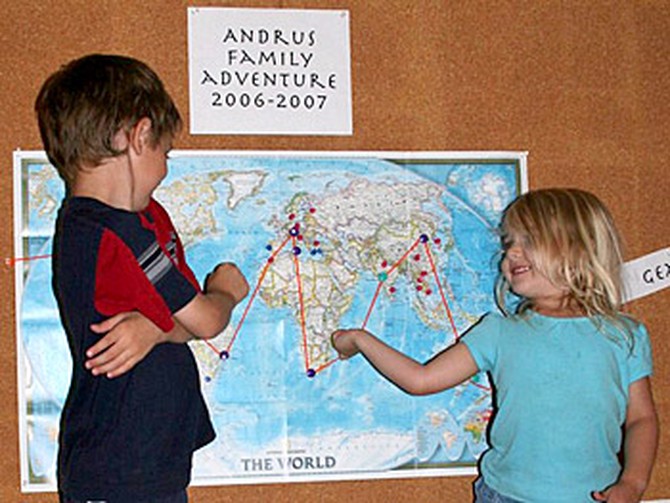 Kieran and Asher look at the plan for their world trip.