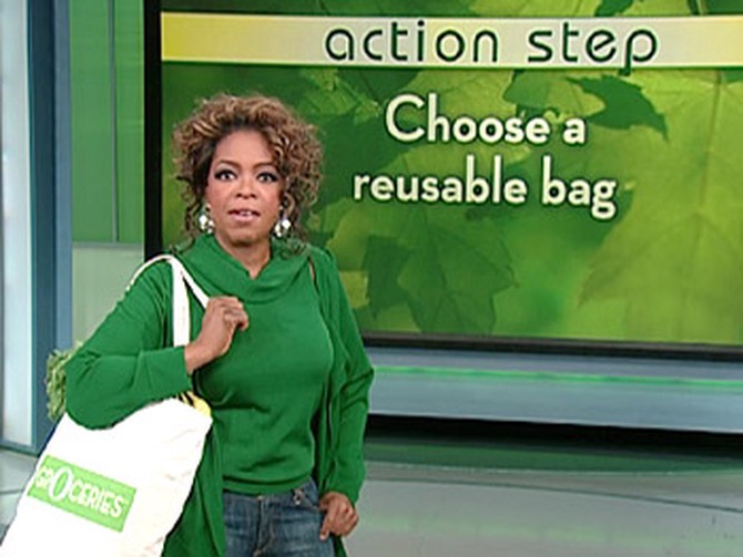 Oprah models her new organic canvas bag.