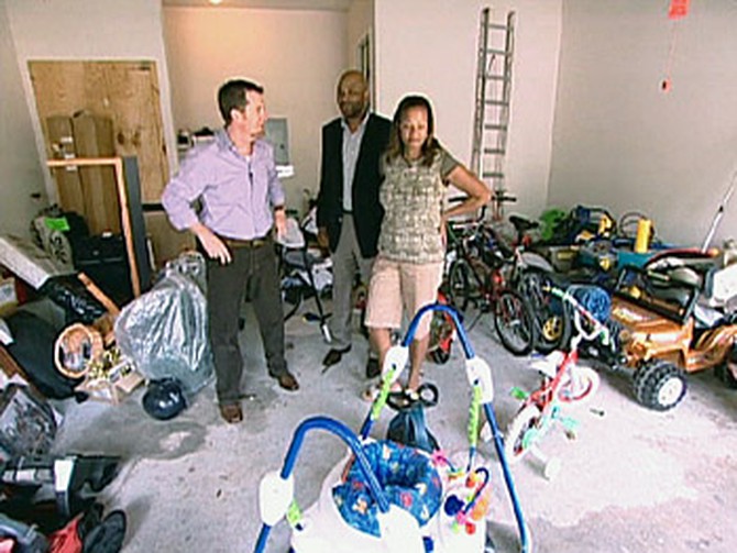 Darius, Peter and Kristen survey the cluttered garage