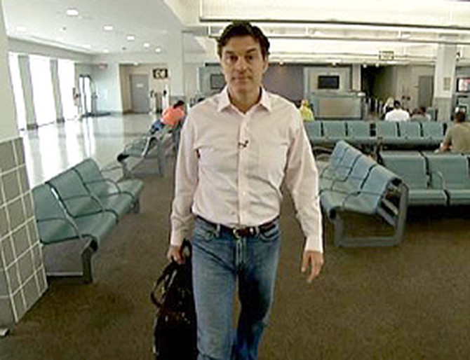 Dr. Oz returns to the airport that once housed a makeshift morgue.