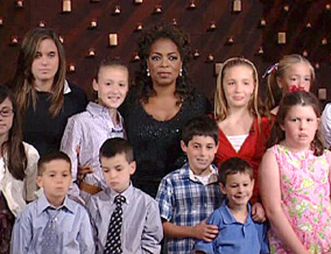 Oprah stands with the children of September 11.