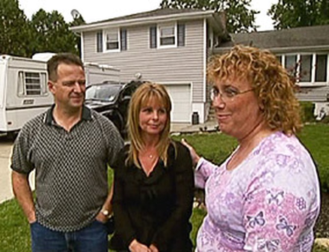 Denise chats with her neighbors.