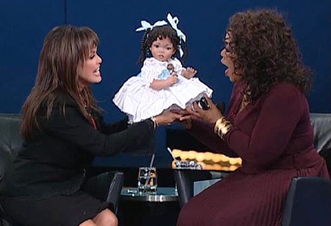 Marie Osmond presents Oprah with a special gift.
