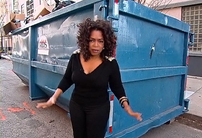 Oprah demonstrate what five tons of garbage looks like.