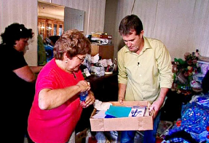 Peter and Sharyrn sort through her possessions.