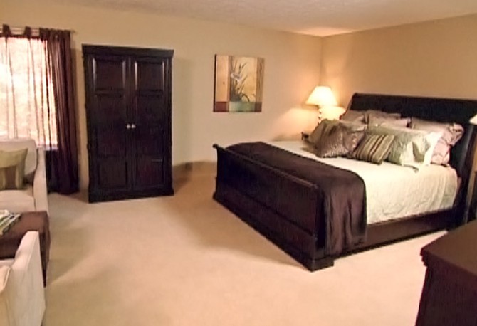 Specific areas are designated for sitting and sleeping in the master bedroom.