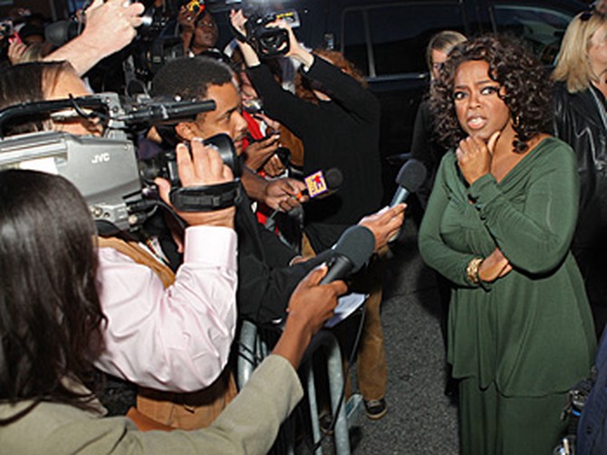Oprah talks to the press.