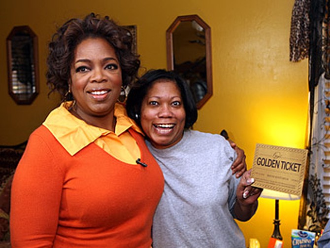 Oprah goes door-to-door in Macon.