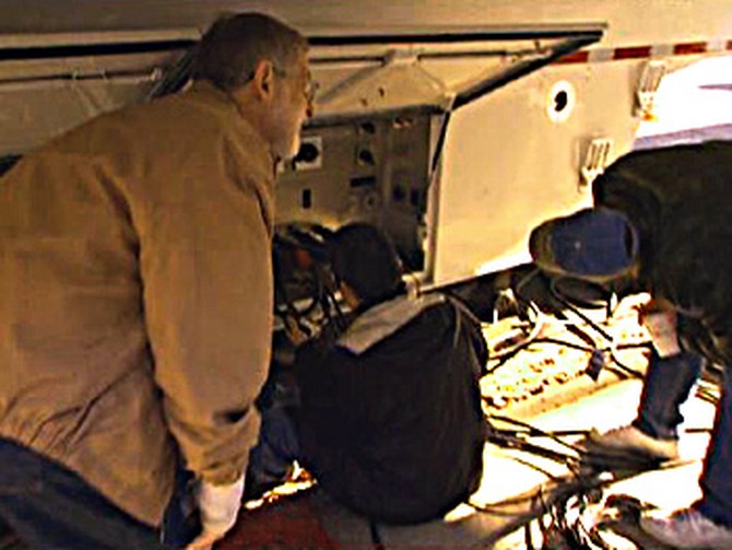The crew scrambles to fix the generator truck.