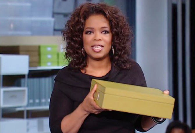 Oprah holds her storage box from The Container Store.