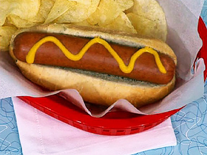 Hot dogs originally were eaten using a glove.