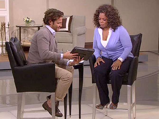 Nate and Oprah check out the Control4 system.