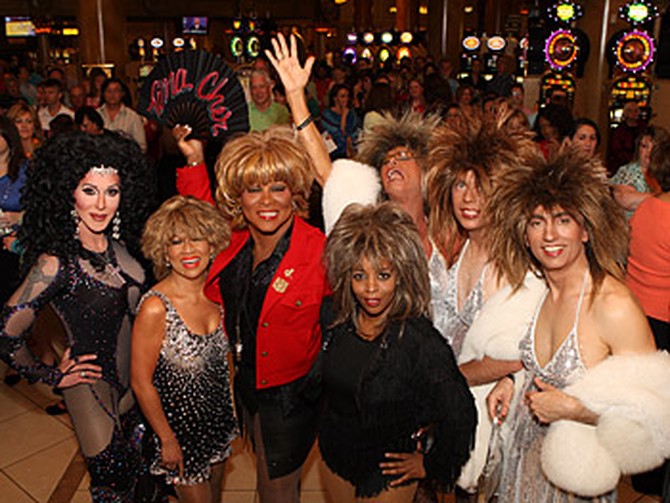 Tina Turner and Cher impersonators line up outside Caesars Palace.