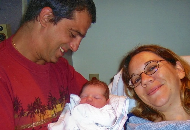 Monica with husband and baby in the hospital