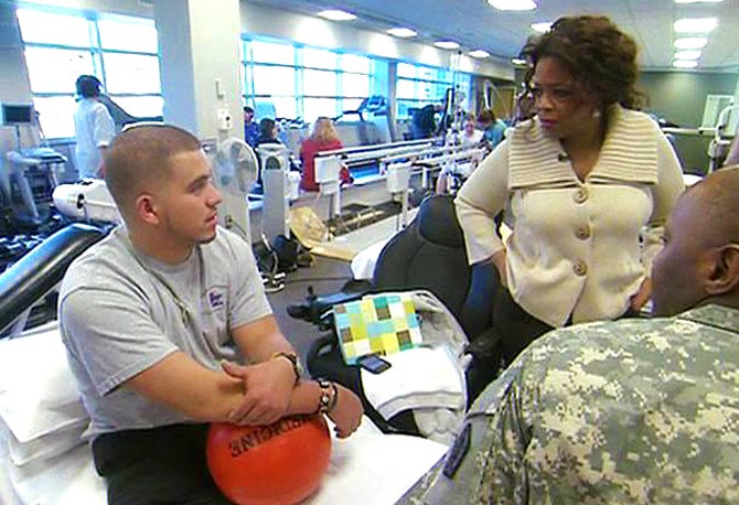 Oprah meets Staff Sgt. Juan Roldan.