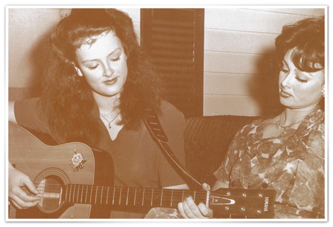 Naomi and Wynonna singing together on the porch