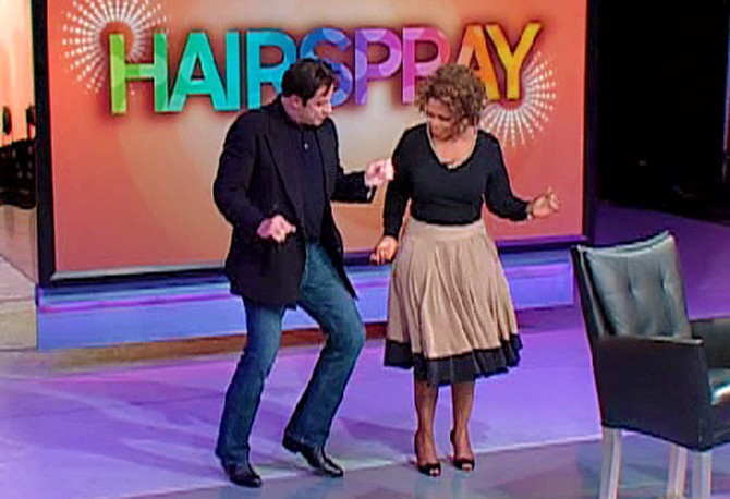 John Travolta dances with Oprah.