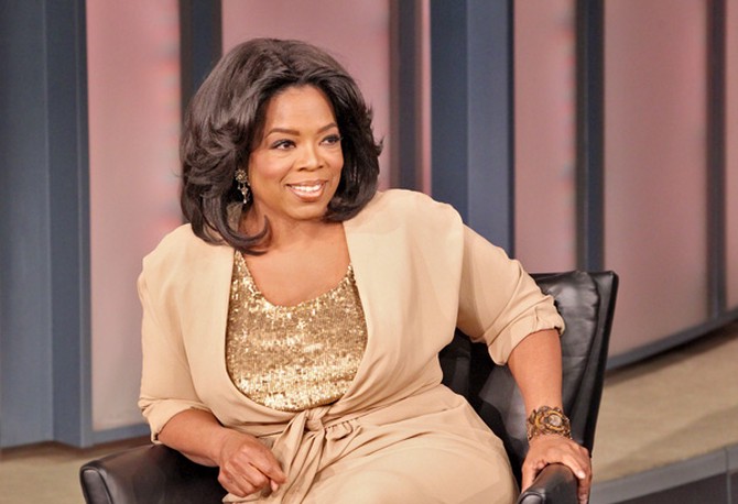 Oprah sitting in a black chair