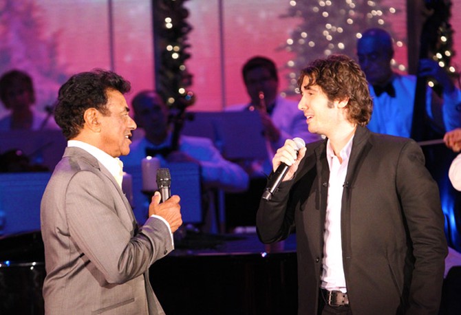 Singers Johnny Mathis and Josh Groban singing a duet