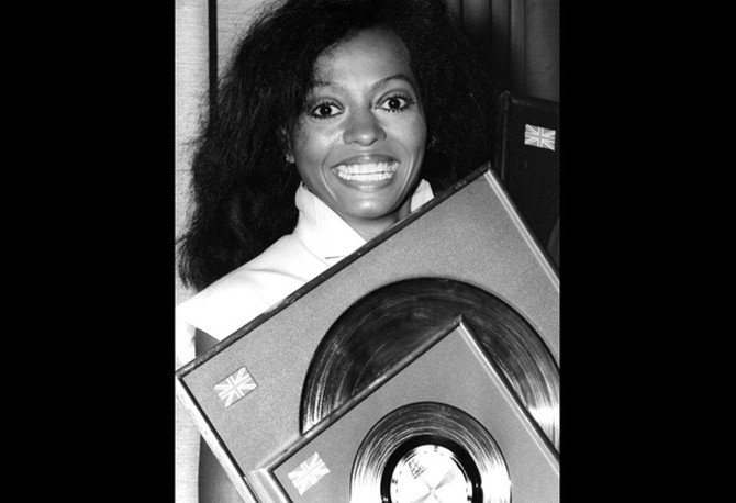 Diana Ross holding discs in 1980