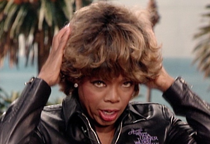 Oprah in her Tina Turner wig.