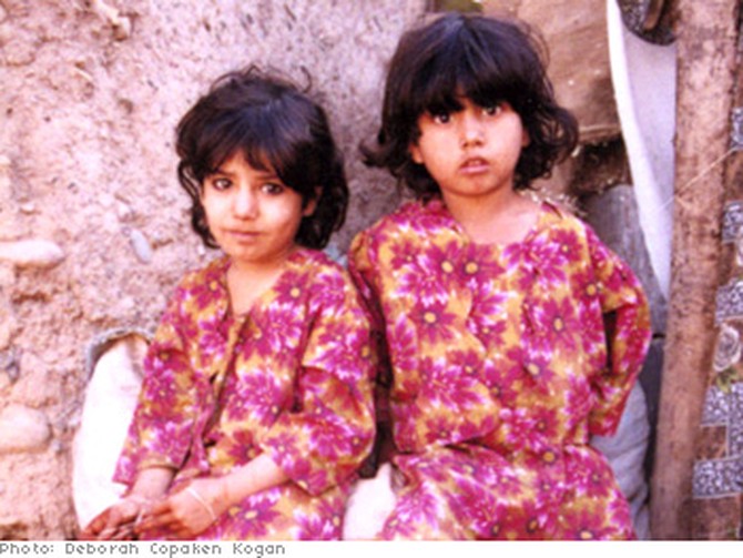 Sisters at the Katcha Garhi refugee camp