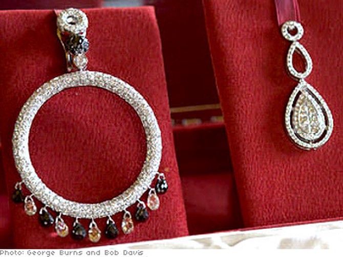 A large hoop dripping with diamonds and an elegant double teardrop