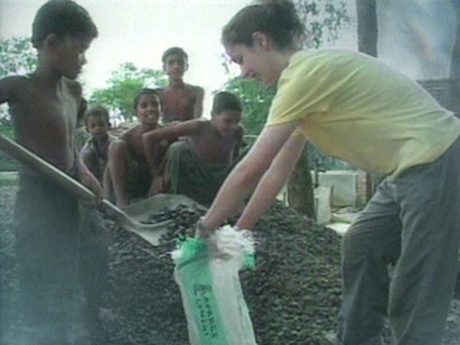 Volunteers help build a school in India.